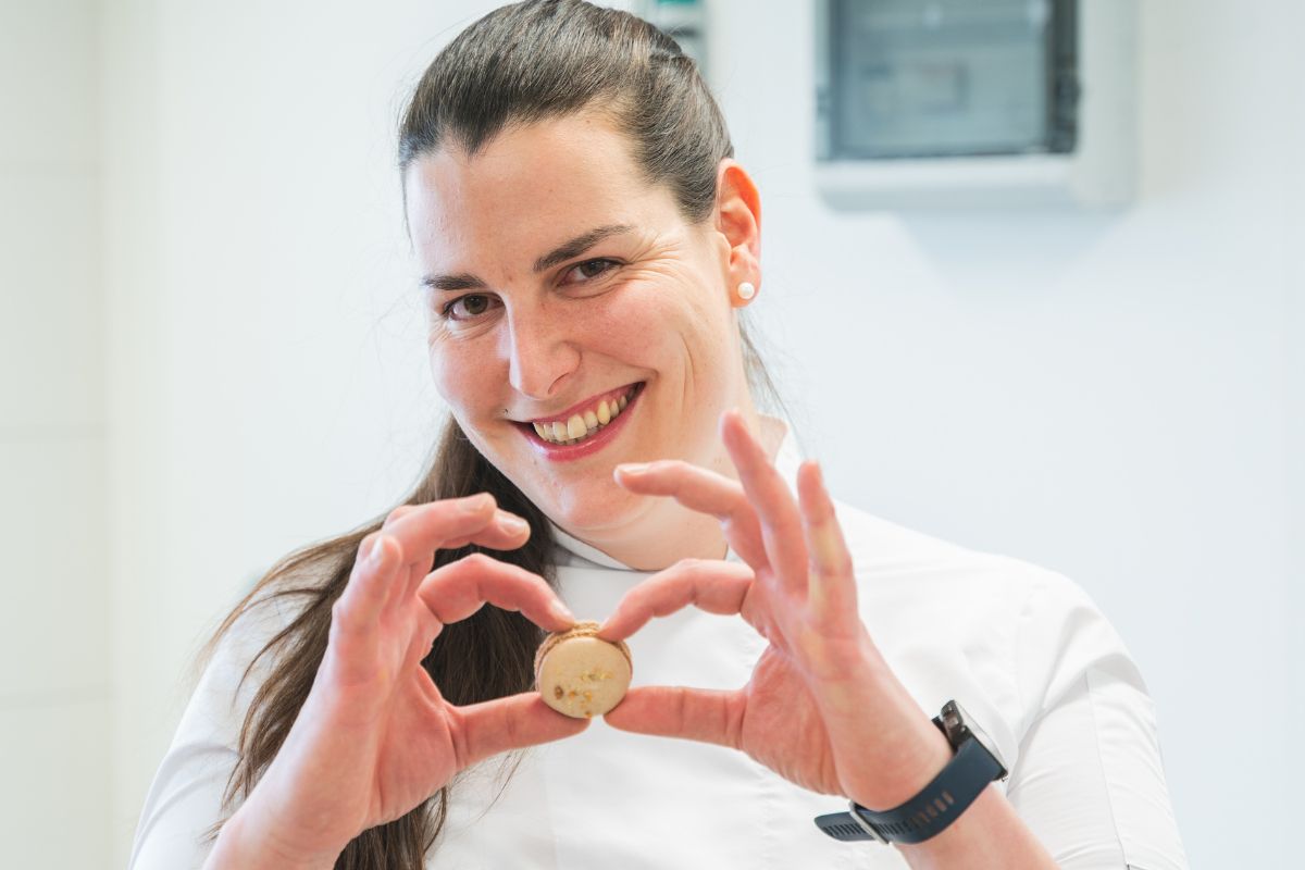 Friendly waiter serves a guest